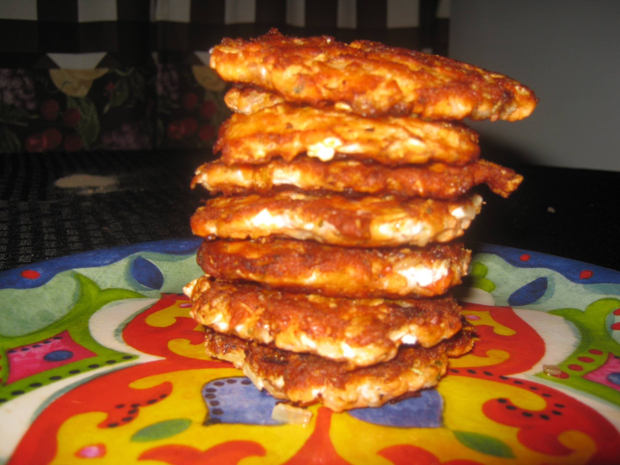 Salmon patties stacked on a plate